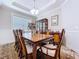 Formal dining room with a decorative table setting at 3643 Arbor Chase Dr, Palm Harbor, FL 34683