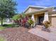 Inviting single-story home with mature landscaping, paver walkway, and well-maintained lawn at 3643 Arbor Chase Dr, Palm Harbor, FL 34683