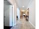 Inviting hallway with tile flooring, archways and decor at 3643 Arbor Chase Dr, Palm Harbor, FL 34683