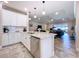 Open kitchen featuring granite countertops, stainless steel appliances, and a view of the living area at 3643 Arbor Chase Dr, Palm Harbor, FL 34683