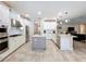 Spacious kitchen featuring white cabinets, stainless appliances, tile floors, and granite countertops at 3643 Arbor Chase Dr, Palm Harbor, FL 34683