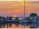 Waterfront scene showcasing a boat docked near sunset, providing serene water reflections at 3643 Arbor Chase Dr, Palm Harbor, FL 34683