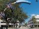 Street view in Clearwater, Florida, showcasing a building and tree-lined street on a clear day at 3643 Arbor Chase Dr, Palm Harbor, FL 34683