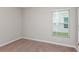 Neutral bedroom with a window providing natural light and neutral carpeting at 37155 Sagemoor Dr, Zephyrhills, FL 33541