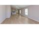 Spacious living area featuring an open floor plan and hardwood floors at 37155 Sagemoor Dr, Zephyrhills, FL 33541