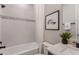 Bathroom features white tile, granite countertop, and shower with glass door at 3765 Obsidian Dr, Spring Hill, FL 34609