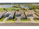 Panoramic aerial view showcases the home's prime location near a golf course, lake, and other luxury homes at 3888 Santa Caterina Blvd, Bradenton, FL 34211