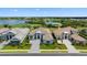 Aerial view of luxurious homes situated on a beautiful landscape with multiple ponds and a golf course at 3888 Santa Caterina Blvd, Bradenton, FL 34211