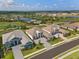 Stunning aerial view of beautiful homes, community lakes, and a golf course at 3888 Santa Caterina Blvd, Bradenton, FL 34211