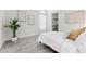 Bright, modern bedroom with a queen-sized bed, complemented by stylish decor and ample natural light at 3888 Santa Caterina Blvd, Bradenton, FL 34211