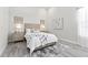 Stylishly decorated bedroom with natural light, featuring a queen-sized bed and coordinated decor at 3888 Santa Caterina Blvd, Bradenton, FL 34211