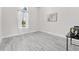 Clean bedroom with window light and modern art on the wall, offering a simple, uncluttered aesthetic at 3888 Santa Caterina Blvd, Bradenton, FL 34211