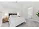 Bedroom showcases a queen bed, neutral walls, and an ensuite bathroom for convenience and privacy at 3888 Santa Caterina Blvd, Bradenton, FL 34211