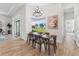 Bright dining room with modern chandelier and a large window overlooking the water at 3888 Santa Caterina Blvd, Bradenton, FL 34211