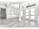 The home's foyer features high ceilings, neutral decor, gray flooring, and double front doors at 3888 Santa Caterina Blvd, Bradenton, FL 34211