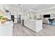 Modern kitchen featuring white cabinetry, stainless steel appliances, and gray floors at 3888 Santa Caterina Blvd, Bradenton, FL 34211