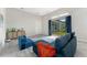 Bright living room with sliding glass doors and blue modular seating at 3888 Santa Caterina Blvd, Bradenton, FL 34211