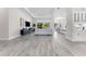 Living room featuring an open concept, gray flooring, recessed lights, and an exterior view of a golf course at 3888 Santa Caterina Blvd, Bradenton, FL 34211