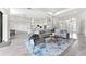 Open-concept living room with tile flooring, recessed lighting, neutral color palette, and seamless kitchen access at 3888 Santa Caterina Blvd, Bradenton, FL 34211