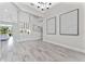 Bright living area boasts elegant tile floors, a bar, and oversized windows for spectacular natural lighting at 3888 Santa Caterina Blvd, Bradenton, FL 34211