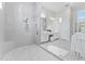 Luxurious main bathroom offering a spa-like shower, white vanities, and sleek fixtures creating a serene oasis at 3888 Santa Caterina Blvd, Bradenton, FL 34211