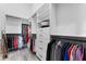 Bright walk-in closet featuring custom shelving, drawers, and ample hanging space for organized storage at 3888 Santa Caterina Blvd, Bradenton, FL 34211