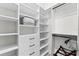 Spacious walk-in closet with custom shelving and hanging rods offering efficient storage solutions at 3888 Santa Caterina Blvd, Bradenton, FL 34211