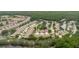 Aerial view of neighborhood shows surrounding trees, ponds, and location at 4032 Salem Square Ct, Palm Harbor, FL 34685