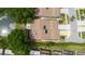 Birds eye of home showing screened lanai, driveway and proximity to neighbors at 4032 Salem Square Ct, Palm Harbor, FL 34685