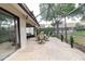 View of covered screened-in lanai in backyard at 4032 Salem Square Ct, Palm Harbor, FL 34685