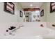 Bathroom featuring a large soaking tub and vanity with decorative accents at 4032 Salem Square Ct, Palm Harbor, FL 34685