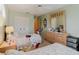 Comfortable bedroom with twin beds, ceiling fan, and dresser with decorative mirror at 4032 Salem Square Ct, Palm Harbor, FL 34685