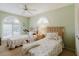 Comfortable bedroom featuring two twin beds, soft, matching floral bedding, and ample natural light at 4032 Salem Square Ct, Palm Harbor, FL 34685