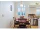Bright dining area features an arched window, pendant lighting, and a wood dining table for intimate meals at 4032 Salem Square Ct, Palm Harbor, FL 34685