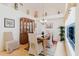 Charming dining room featuring a glass table, elegant hutch, and a window view at 4032 Salem Square Ct, Palm Harbor, FL 34685