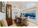 Bright dining area with glass table, stylish décor, and large window at 4032 Salem Square Ct, Palm Harbor, FL 34685