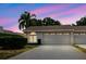 Charming single-story home with a two-car garage, manicured landscaping, captured under a beautiful sky at 4032 Salem Square Ct, Palm Harbor, FL 34685