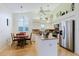 Bright kitchen features an island, stainless steel appliances and a cozy dining area at 4032 Salem Square Ct, Palm Harbor, FL 34685