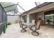 View of covered screened-in lanai with tile flooring, ceiling fan, and water view at 4032 Salem Square Ct, Palm Harbor, FL 34685