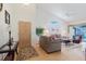 Inviting living room with vaulted ceilings, neutral-toned furniture, wood flooring, and natural light at 4032 Salem Square Ct, Palm Harbor, FL 34685