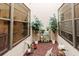 Private patio adorned with plants and decorative figurines for a tranquil outdoor space at 4032 Salem Square Ct, Palm Harbor, FL 34685