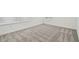 Spacious bedroom featuring neutral carpet and natural light from two windows at 4210 Goldfoil Rd, Spring Hill, FL 34609