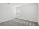 Bedroom with window and neutral carpet flooring at 4210 Goldfoil Rd, Spring Hill, FL 34609