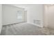 Clean bedroom with carpet, window, and a fresh, neutral color scheme at 4210 Goldfoil Rd, Spring Hill, FL 34609