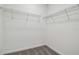 Walk-in closet featuring wire shelving and neutral carpeting at 4210 Goldfoil Rd, Spring Hill, FL 34609