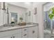 Double vanity bathroom with granite counters and a plant for decor at 4316 Sailplane Ct, Wesley Chapel, FL 33545