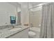 Bright bathroom with granite counters, vanity, and shower-tub combination at 4316 Sailplane Ct, Wesley Chapel, FL 33545