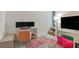 Bedroom/office area features a desk, monitors, and plush seating at 4316 Sailplane Ct, Wesley Chapel, FL 33545