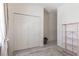 Spare bedroom with white walls, a closet, and view to another room at 4316 Sailplane Ct, Wesley Chapel, FL 33545
