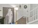 Elegant entryway featuring hardwood floors, a white staircase, and stylish decor at 4316 Sailplane Ct, Wesley Chapel, FL 33545